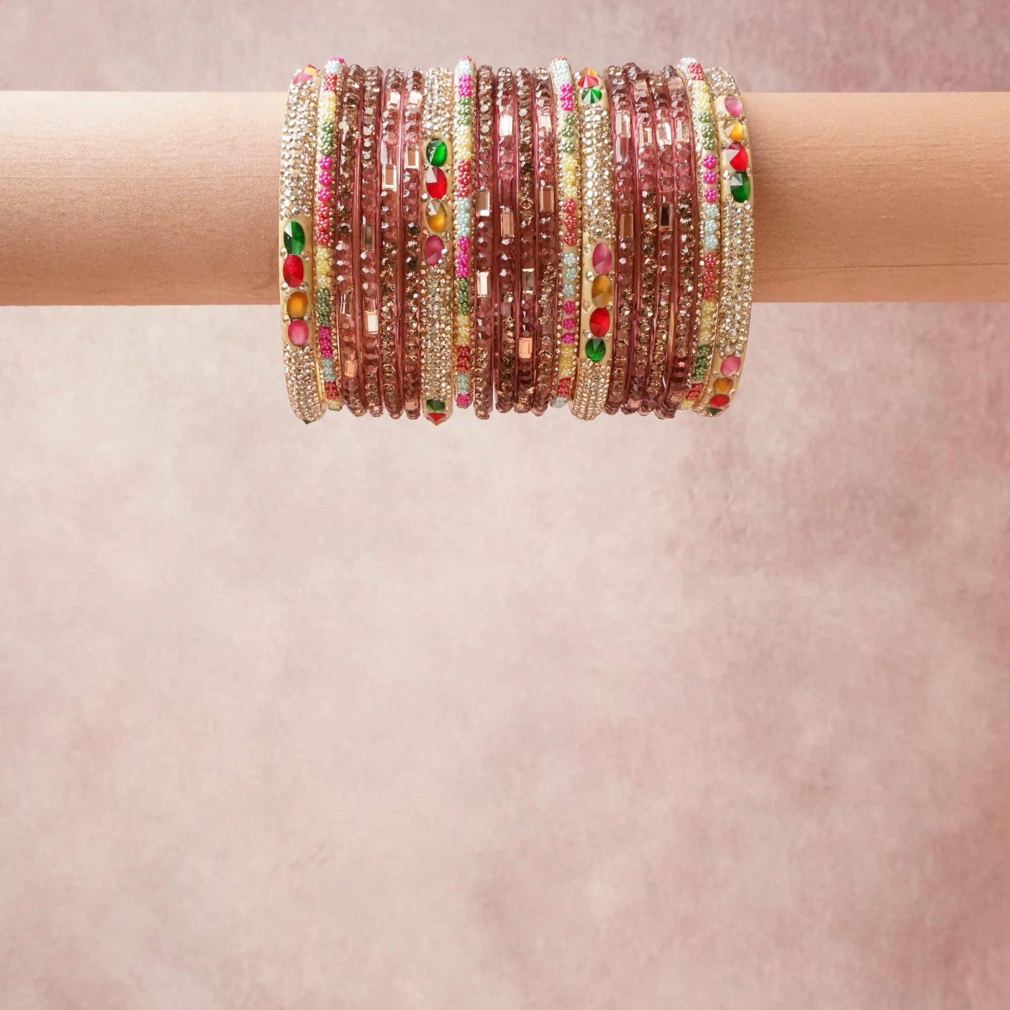 A grounding Muted Plum forms the heart of the set, while touches of Clear, Fuchsia, Emerald Green, Ruby Red, Aqua Blue, Amber add charm.

A thoughtful composition of Glass, Rhinestone, Enamel, Base Metal, designed to feel complete without being heavy.
Each element layers seamlessly, creating a look that is refined, wearable and quietly striking.